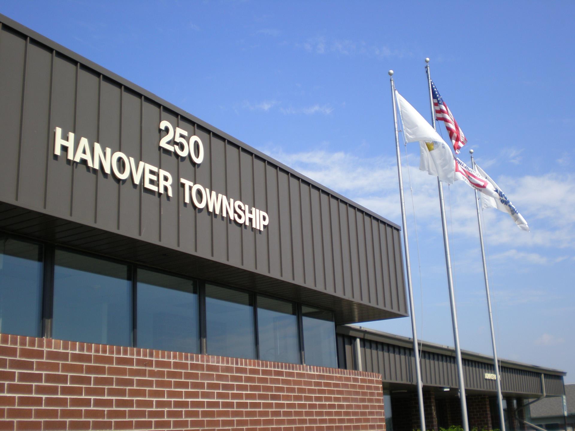 Front of brick building on a sunny day.